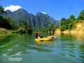 Tourist going down Nam Song River in a tube surrounded by karst Royalty Free Stock Photo