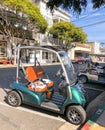 Tourist golf cart parked on city street, Avalon, Catalina Island