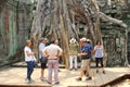 Tourist group ancient Ta prohm temple Angkor, Cambodia