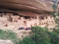 Tourist group at complex of ancient ruins at Mesa Verde National Park