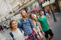 Tourist friends discovering city on foot Royalty Free Stock Photo