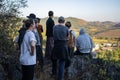 A tourist group looking out over a rural village, Myanmar