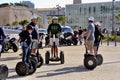 Tourist group moving Segway