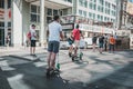 Tourist group riding Electric scooter , escooter or e-scooter on street in Berlin