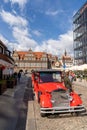 Tourist guides and taxis wait for business in front of the Green Gate in the historic city center of Gdansk