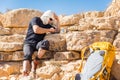 Guy sitting messaging phone sms while resting desert travel.