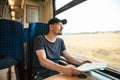 A tourist or a guy or a student travels by train. Royalty Free Stock Photo