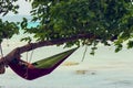 Tourist on a hammock hanging from a tree