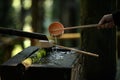 Tourist hand holding a water ladle from Chozucha to wash hands, according to Japanese tradition, a plastic ladle close-up Royalty Free Stock Photo