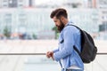 Tourist handsome thoughtful hipster backpack. Man with beard and rucksack explore city. Travelling concept. Tourist on Royalty Free Stock Photo