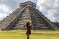 Tourist with hat in the castle and temple of Chichen Itza known as the famous and apocalyptic Mayan pyramid of Mexico Royalty Free Stock Photo