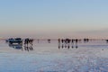 Tourist having fun taking photos of their reflections. Location: Salar de Uyuni, Bolivia