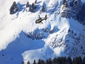 Tourist helicopter passenger transport during the winter in the Swiss Alps