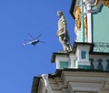 Tourist helicopter in the sky over the Winter Palace