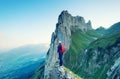 Tourist on the high rocks background. Sport and active life concept. Adventure and travel Royalty Free Stock Photo