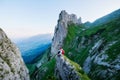 Tourist on the high rocks background. Sport and active life concept. Adventure and travel in Switzerland Royalty Free Stock Photo