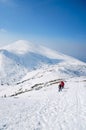 Tourist hike in a winter mountains