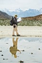 Tourist hiker with compass and map in mountains Royalty Free Stock Photo