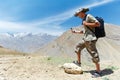 Tourist hiker with compass in mountains Royalty Free Stock Photo