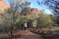 Tourist hiking at Kata Tjuta Olgas in Uluru-Kata Tjuta National Park Landscape view of Uluru-Kata Tjuta National Park Northern