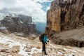 Tourist hiking in mountains Sella Ronda