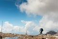 Tourist hiking in mountains Sella Ronda