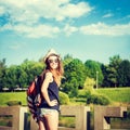 Tourist Hipster Girl Relaxing in the Park