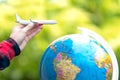 Tourist holding airplane flight travel traveller fly travelling citizenship air on the around world. Royalty Free Stock Photo