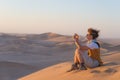 Tourist holding smart phone and taking photo at scenic sand dunes at Sossusvlei, Namib desert, Namib Naukluft National Park, Namib Royalty Free Stock Photo