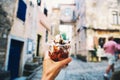 Tourist holds Fritule on street in Croatia. Croatian homemade fr Royalty Free Stock Photo