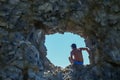 Tourist in the hole of Sail rock in Praskoveevka near Gelendzhik. Krasnodar Krai