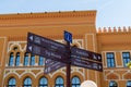 Tourist info sign with directions in front of old gymnasium in Mostar