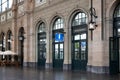 Tourist information center or office inside train station in European city, no people