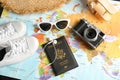Tourist items on world map, above view. Travel