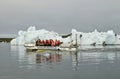 Tourist at Jokulsarlon glacier lagoon in south Iceland