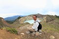 Tourist on Kelimutu watching unique lakes Tap and Tin Royalty Free Stock Photo