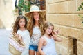 Tourist kid girls group in mediterranean white town Royalty Free Stock Photo