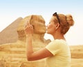 Tourist kissing the Sphinx, Cairo, Egypt. Kiss of the Sphinx Royalty Free Stock Photo