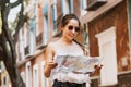 Tourist latin girl with map, travel, leisure, holidays in a Hispanic and colonial city in Mexico