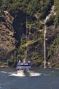 Tourist launch at Milford Sound, New Zealand Royalty Free Stock Photo