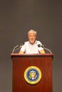 tourist at the lectern of John F. Kennedy with the seal of the president of the USA in the sixth floor museum in Dallas Royalty Free Stock Photo