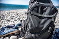 Backpack and sneakers are on the beach near the sea. they left the tourist Royalty Free Stock Photo