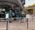 Tourist lifting his bicycle to get inside the Snowmass hill lift ride