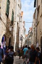 Tourist in Little tipical street in the old town of Dubrovnik