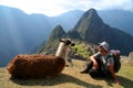 Tourist and llama in Machu Picchu