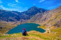 Tourist looking at beautiful Snowdonia mountains.