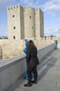 Tourist looking Calahorra tower by urban telescope Royalty Free Stock Photo
