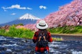 Tourist looking at cherry blossoms and fuji mountains in Shizuoka, Japan