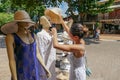 Tourist looking at clothes at a little stand