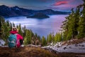 Tourist looking at Crater Lake Oregon Landscape Royalty Free Stock Photo